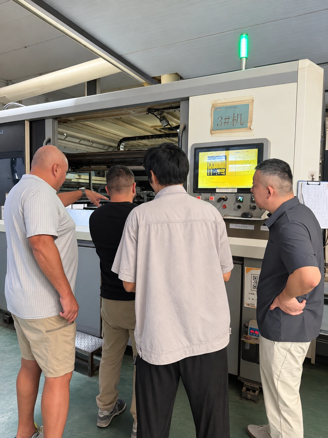 Visitors discussing equipment use at the SJ-1200 control console